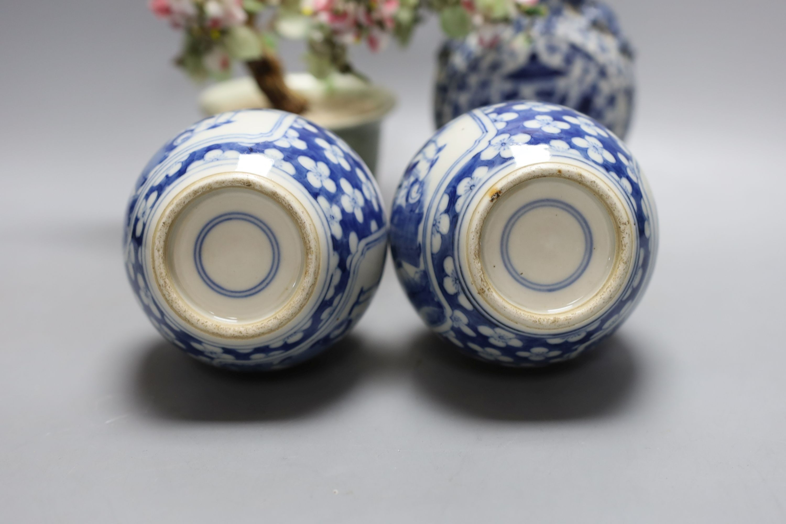 A pair of Chinese blue and white double gourd vases, similar moonflask and flower ornament 18cm